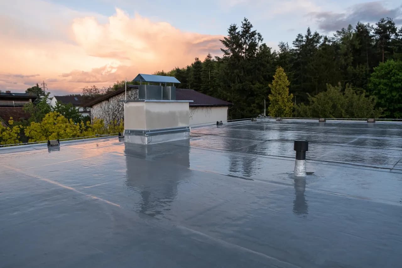 Finished commercial flat roof at dusk